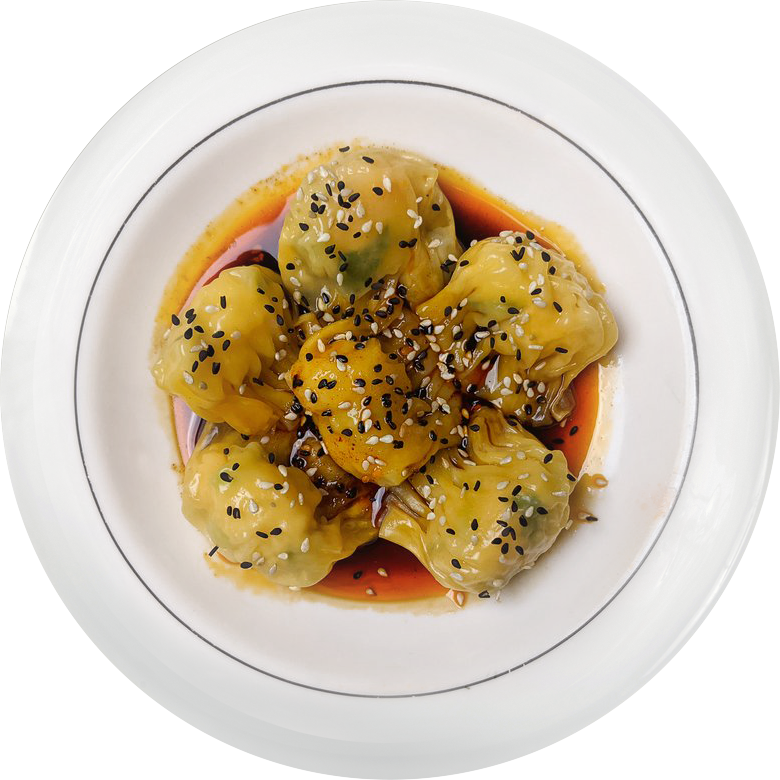 Dumplings with sesame seeds in chili oil sauce