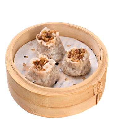 Steamed dim sum dumplings in a bamboo steamer basket